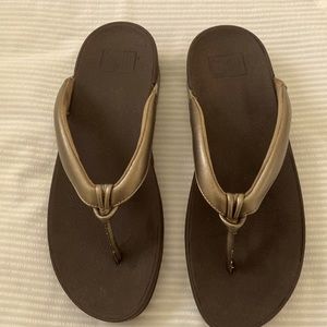 Gold tone Fitflops size 9